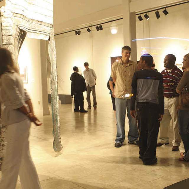 people looking at art in a museum in mobile alabama