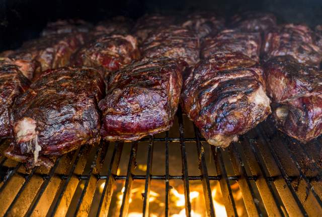 steaks on a fire grill