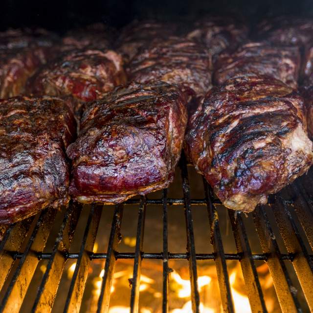 steaks on a fire grill