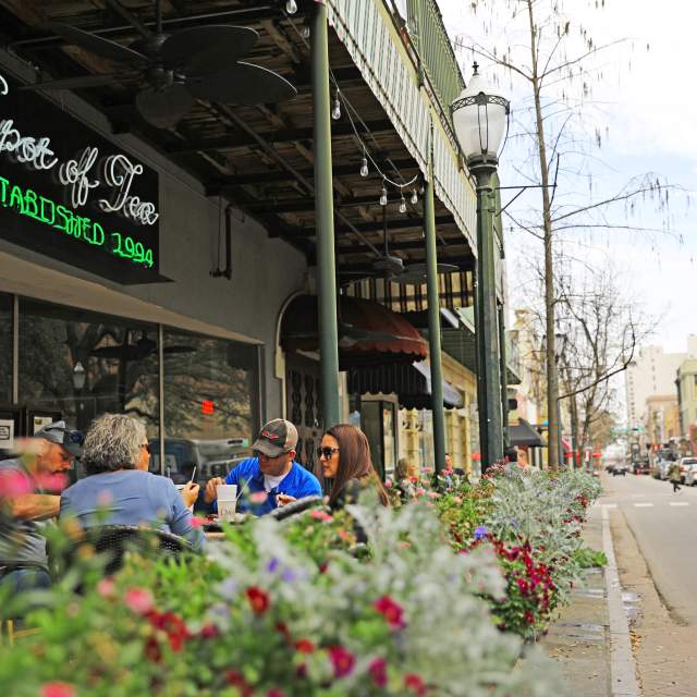 outdoor seating on the sidewalk of Dauphin Street, downtown Mobile