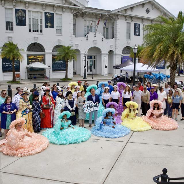 Group of people with Azalea Trail maids in front of the History Museum