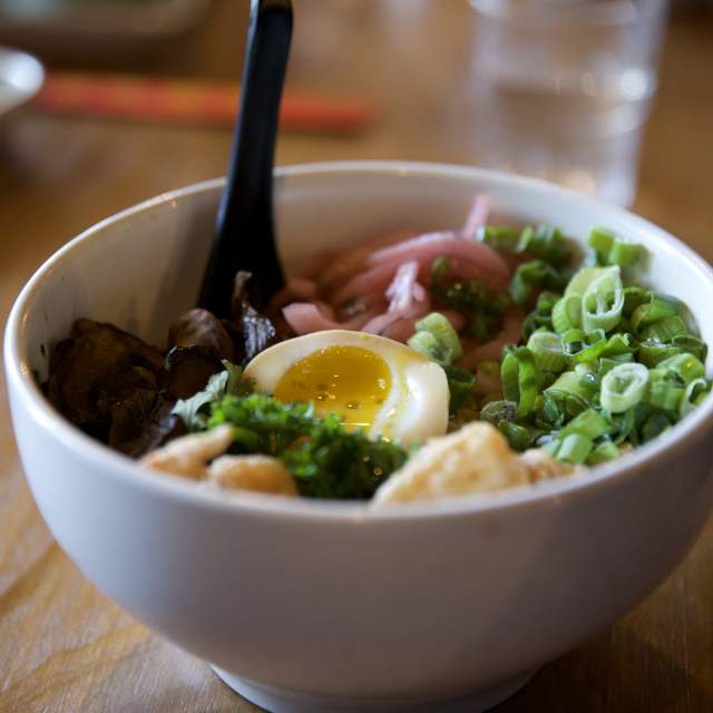 Bowl of ramen sitting on table