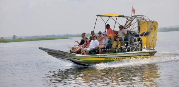 Group of people riding an airboat