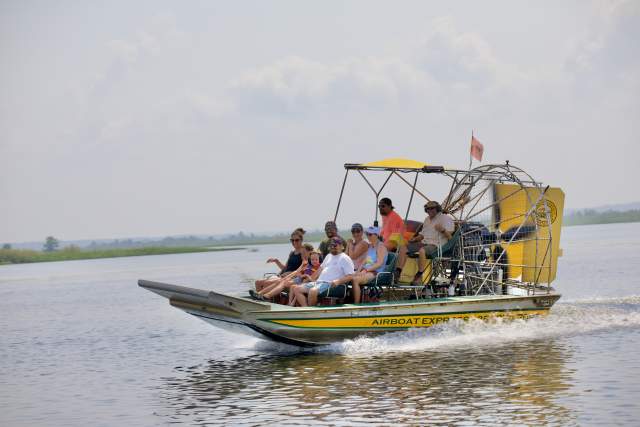 Group of people riding an airboat