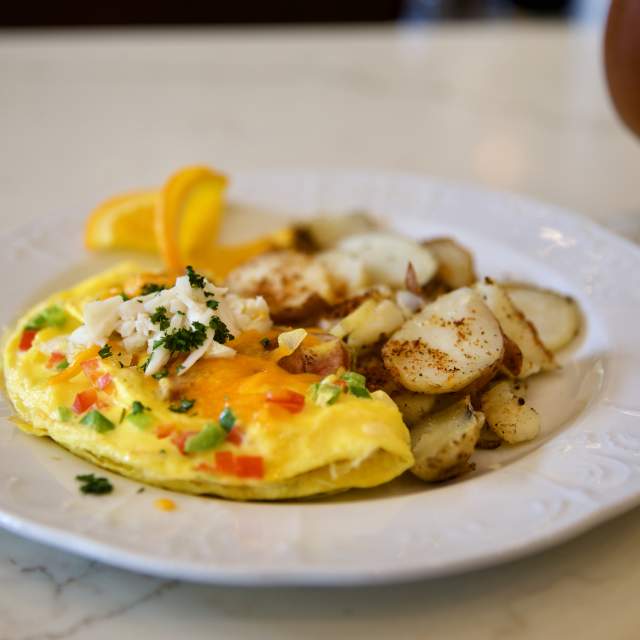 omelet and diced potatoes on a plate