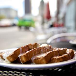 Plate of French toast sitting on a table