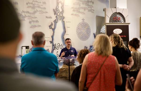 group of people listening to a presentation