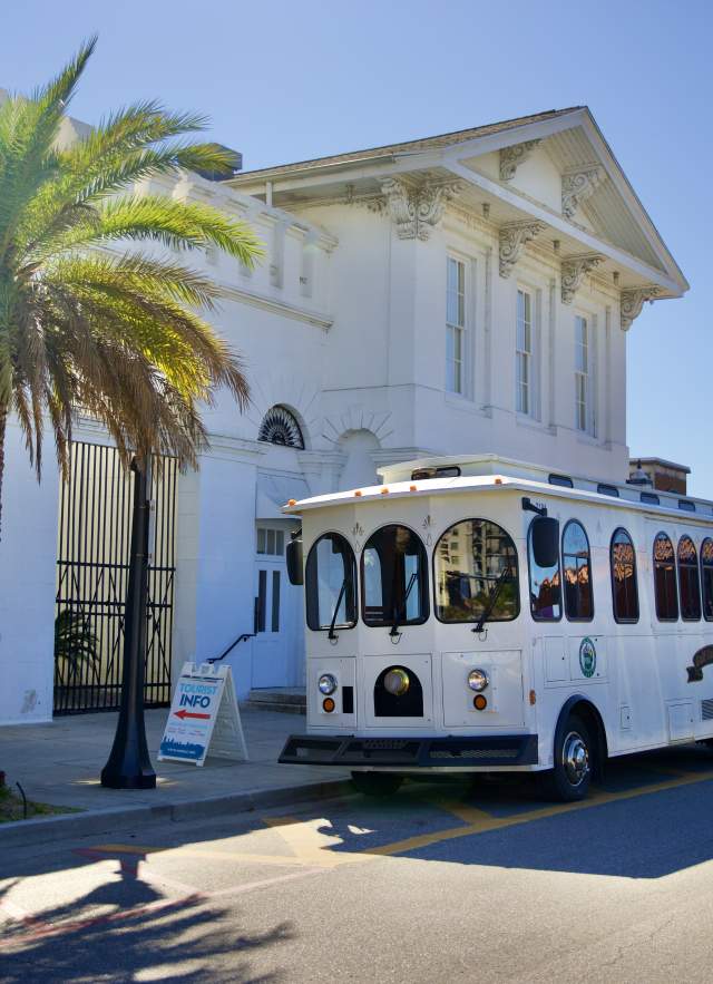 tour bus parked in front of the History Museum