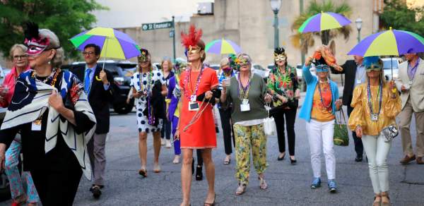 crowd of people in a Mardi Gras procession