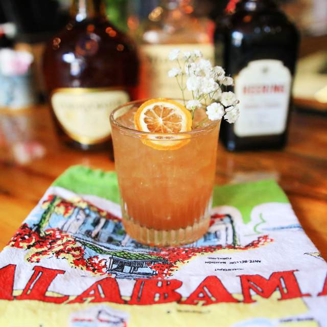 cocktail with orange garnish