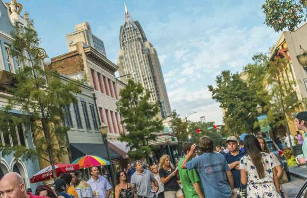 group of people walking in the street downtown
