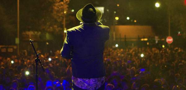 view from a stage behind the performer looking over the crowd