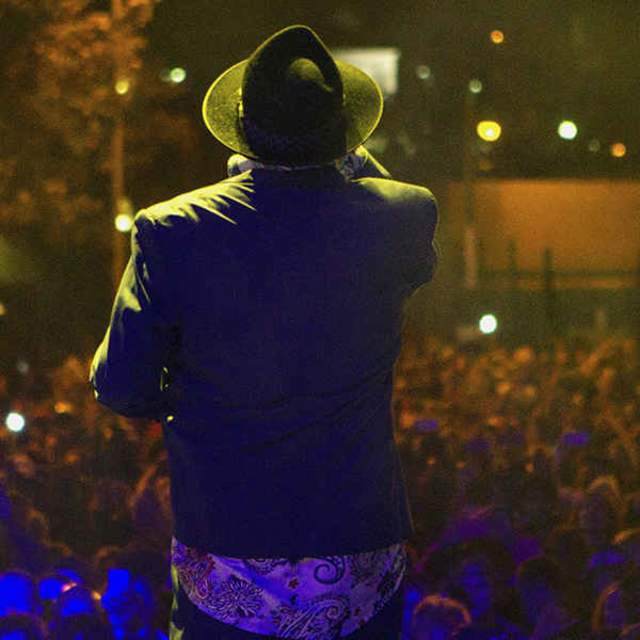 view from a stage behind the performer looking over the crowd