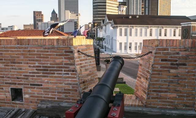 cannon at the Colonial Fort Conde in front of the cityscape