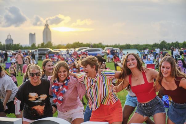 Group of people dancing at USS ALABAMA Battleship Memorial Park