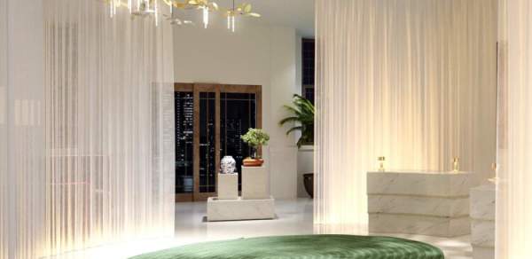 room with sheer curtains, a round, rug and chandellier