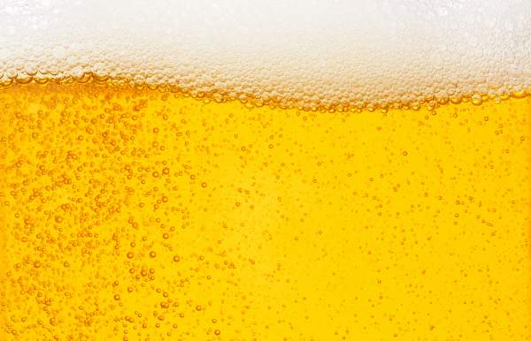 close up of beer with suds