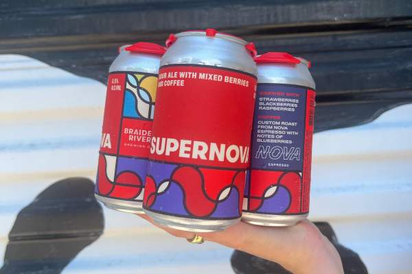 three cans of beer with red and purple labels