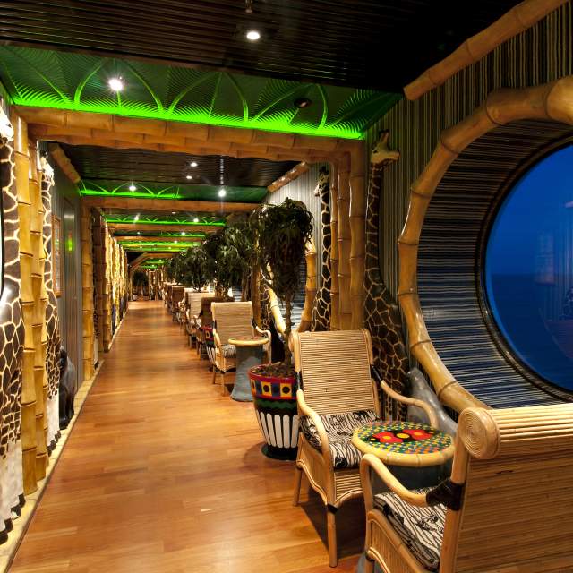 Hallway with large port windows trimmed in bamboo