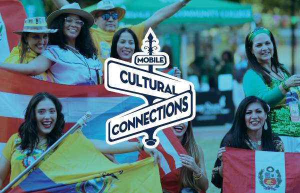 Latina women wearing brightly colored clothing and holding flags from their countries with Mobile Cultural Connections logo