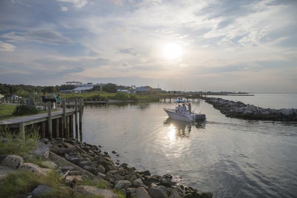 Small boat coasting on the waters of Dauphin Island