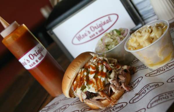 BBQ sandwich, macaroni and cheese, cole slaw and bbq sauce