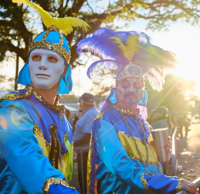 Two men in Mardi Gras costumes