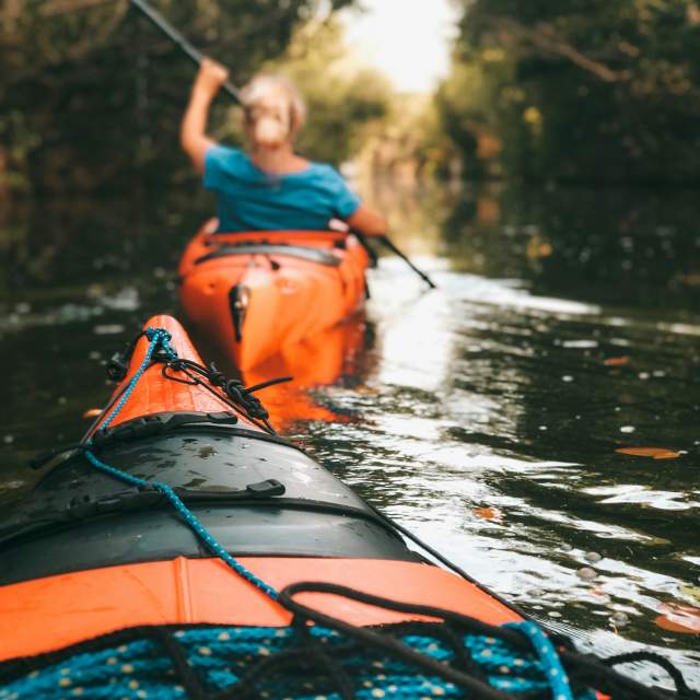Orange kayaks in the water