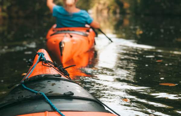 Orange kayaks in the water