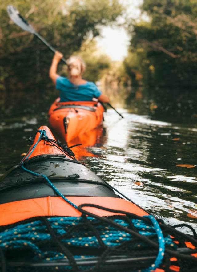 Orange kayaks in the water
