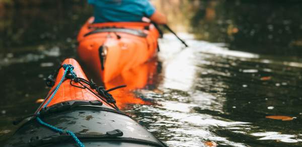 Orange kayaks in the water