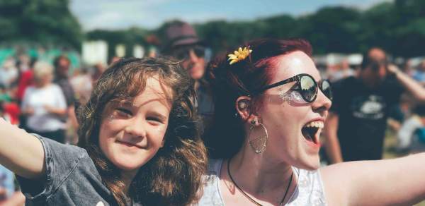 Smiling woman holding a child