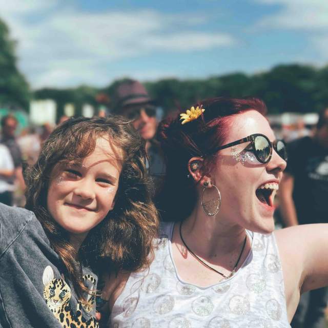 Smiling woman holding a child