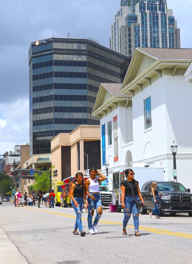 People walking in the street downtown Mobile