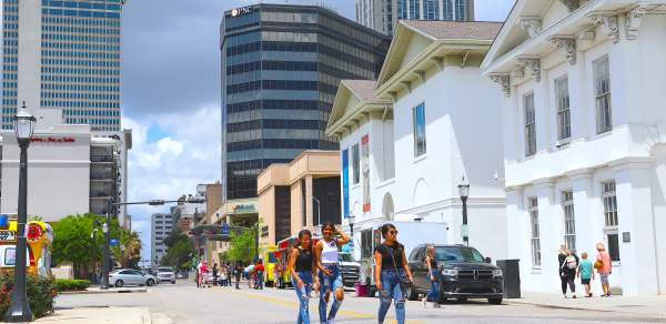 People walking in the street downtown Mobile