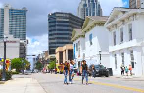 People walking in the street downtown Mobile