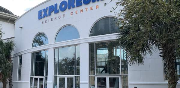 two-story building with three arched doorways