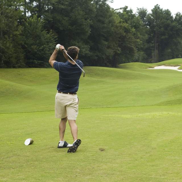 Golfer swinging