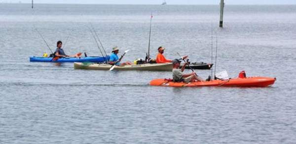 people in three kayaks