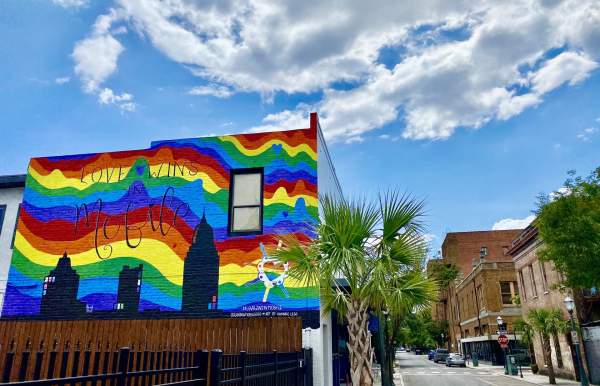 Mural of a rainbow sky over downtown Mobile