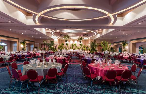 banquet room filled with round tables and chairs