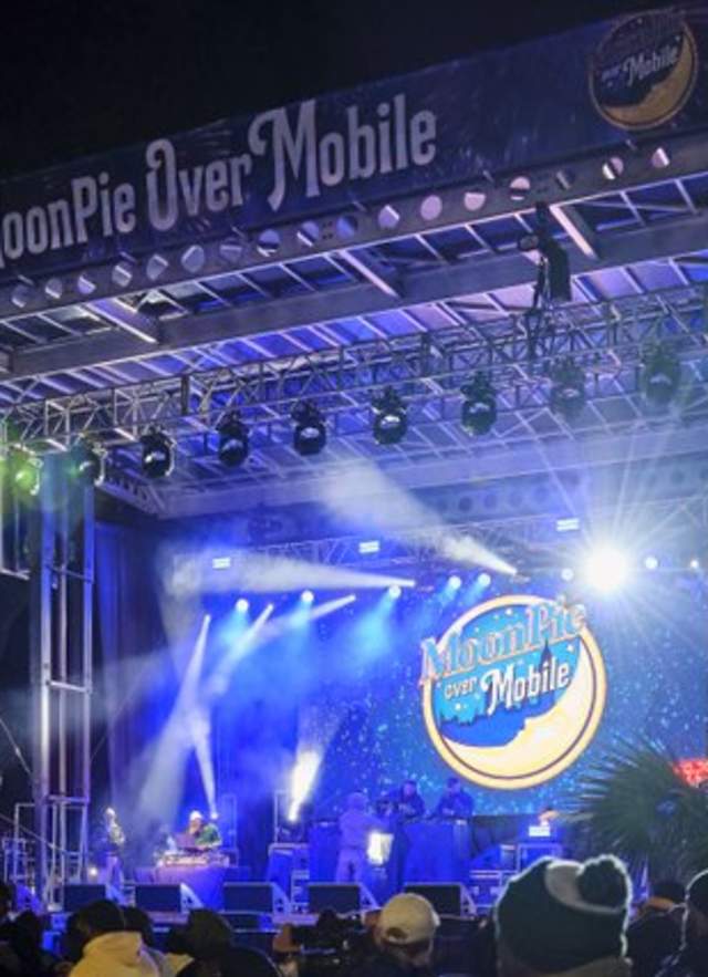 Large stage with musical acts, lights and MoonPie Over Mobile logo