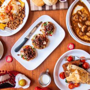 table with a spread of four meals for brunch