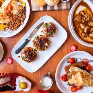 table with a spread of four meals for brunch