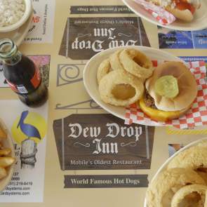 plates of food with cheeseburger and onion rings