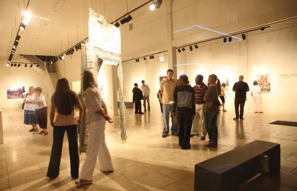People enjoy artwork on display at a museum